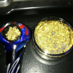 pipe with weed in it and a grinder with weed in it