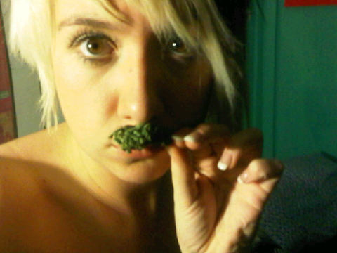 a cute stoner chick with a weed mustache